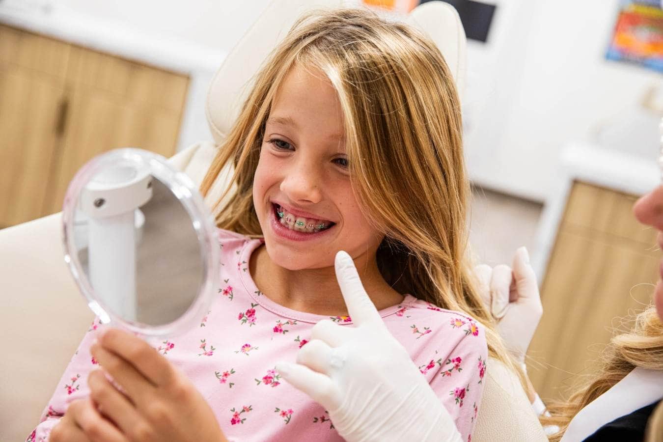 child admiring new braces