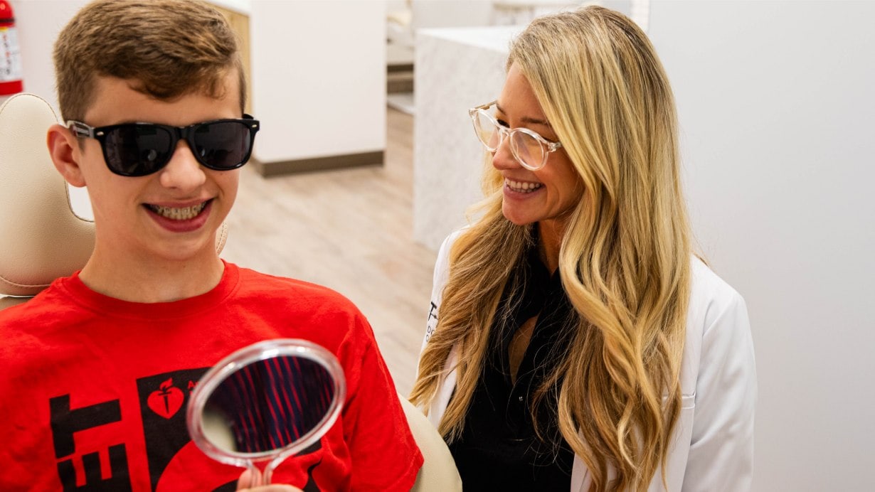 Dr. Otto with male patient wearing braces